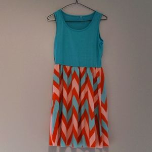 Orange and teal knee length dress
